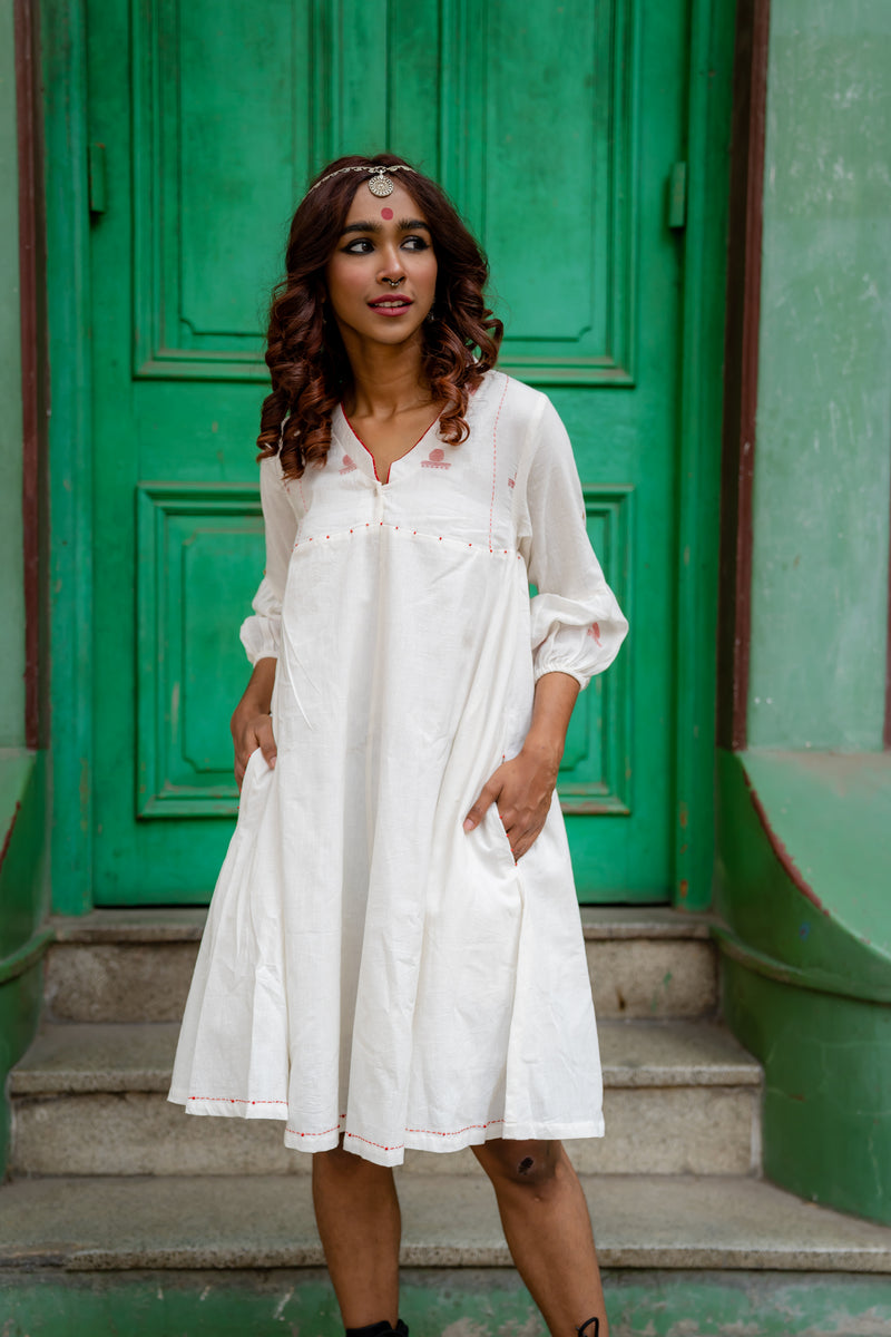 White Handloom Cotton A-Line Panelled Shvet Dress from Prathaa, styled for Ganesh Chaturthi kitchen prep